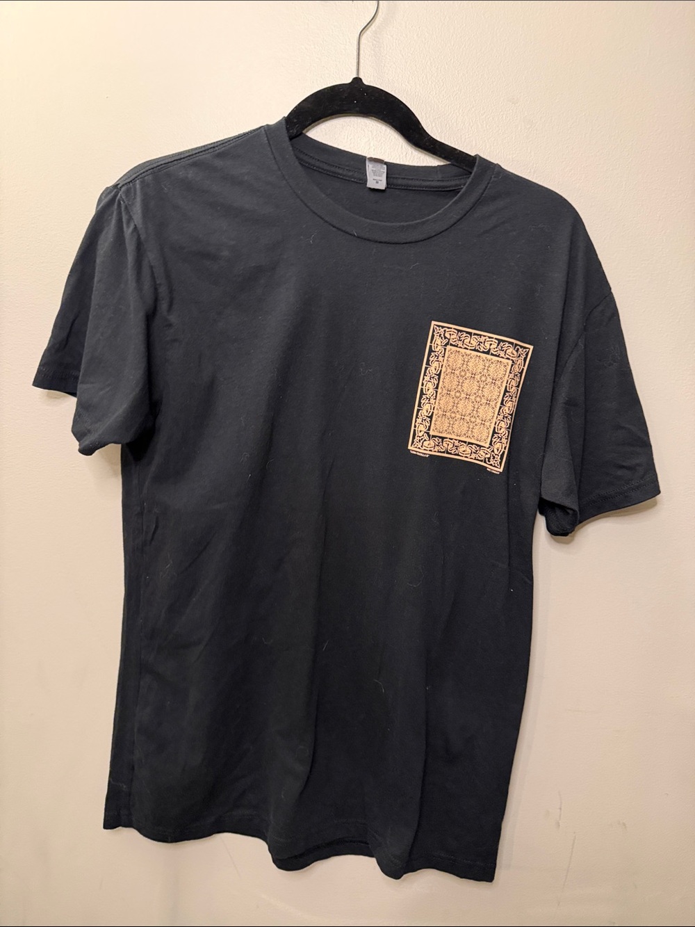 Next Level Apparel Black Short Sleeve Tee with Gold Pocket Graphic
